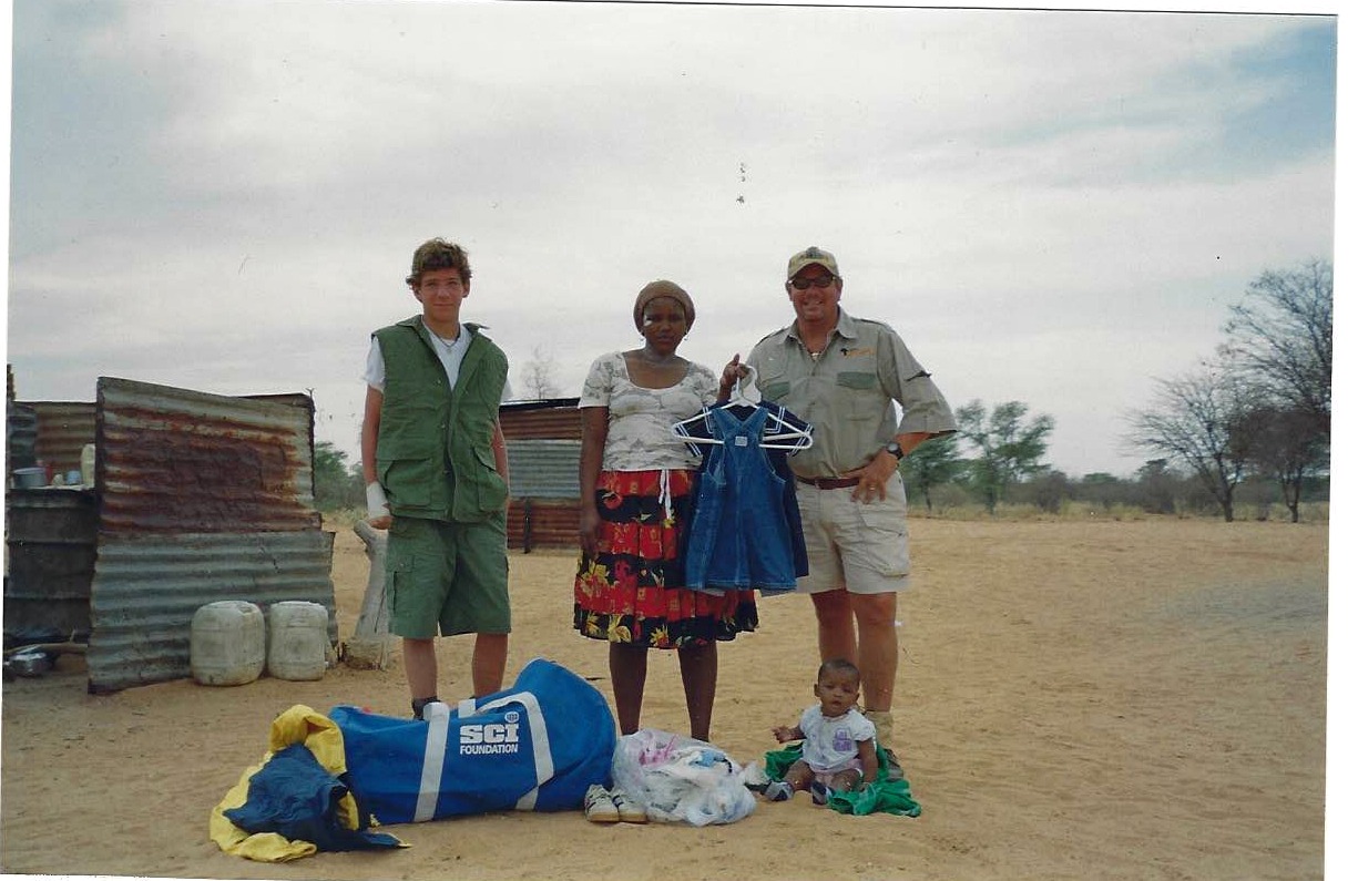 A community visit with donated clothing and supplies